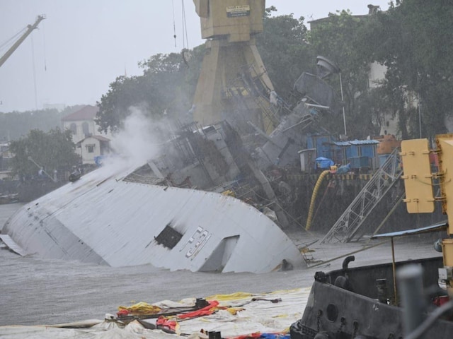 The Navy stated that despite all efforts, the ship could not be brought to the upright position. It continued to list further alongside her berth and is currently resting on one side. (Image: News18)